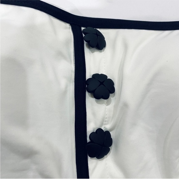 Kate Spade Texture Classic Bandeau
Swimsuit with signature spade buttons NWT - Picture 7 of 9